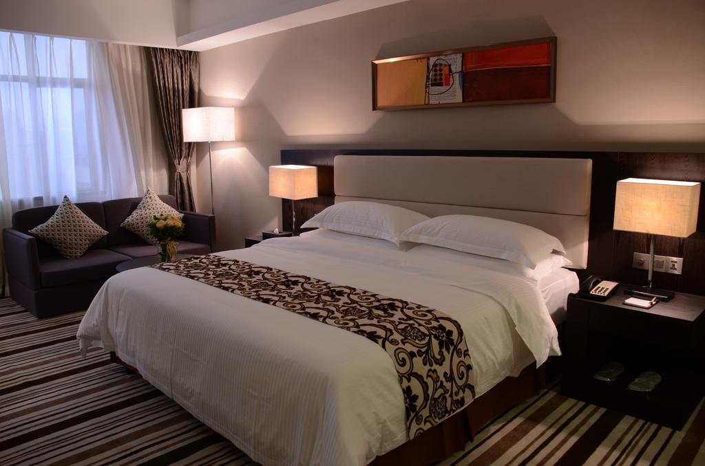 Dongguan Junyue Hotel Quarto foto